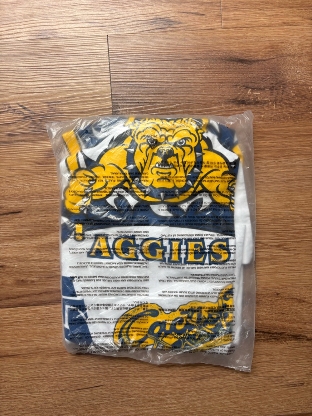 Travis Scott Mitchell & Ness White Graphic Aggies Tee with Yellow & Navy Accents